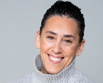 A woman smiling.