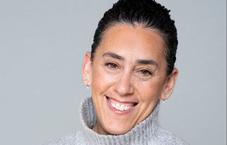 A woman smiling.