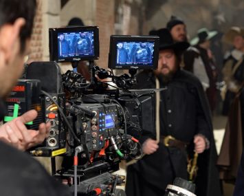 A camera films actor pose on set. After 2020, market experts said studio users would step further into the industrial market to convert into their own space in traditionally secondary markets.