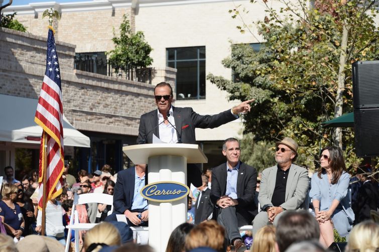 Developer Rick Caruso, Los Angeles Mayor Eric Garcetti, comedian Billy Crystal and producer Janice Crystal attend the Palisades Village grand opening ribbon-cutting ceremony at Palisades Village in 2018.