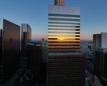 An aerial view shows the tower at 444 South Flower in the downtown Financial District