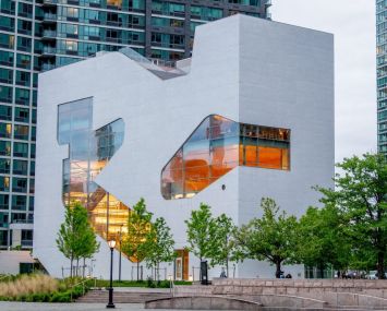 The new $41 million Steven Holl-designed library in the Hunters Point section of Long Island City is emblematic of the construction cost overruns and delays associated with the city's Department of Design and Construction.