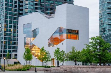 The new $41 million Steven Holl-designed library in the Hunters Point section of Long Island City is emblematic of the construction cost overruns and delays associated with the city's Department of Design and Construction.