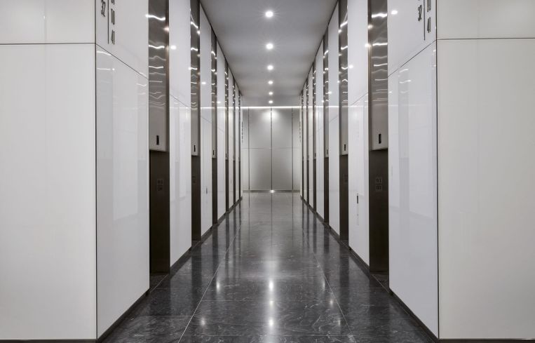 In addition to a renovation of the elevator lobby, the elevator systems were upgraded during the pandemic to destination dispatch.