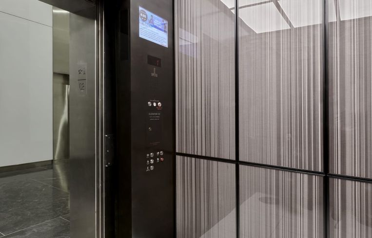 The elevator cabs were redone in lighter colors and panelling as well.
