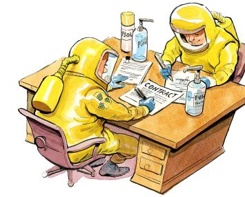 Two men at desk in hazmat suits