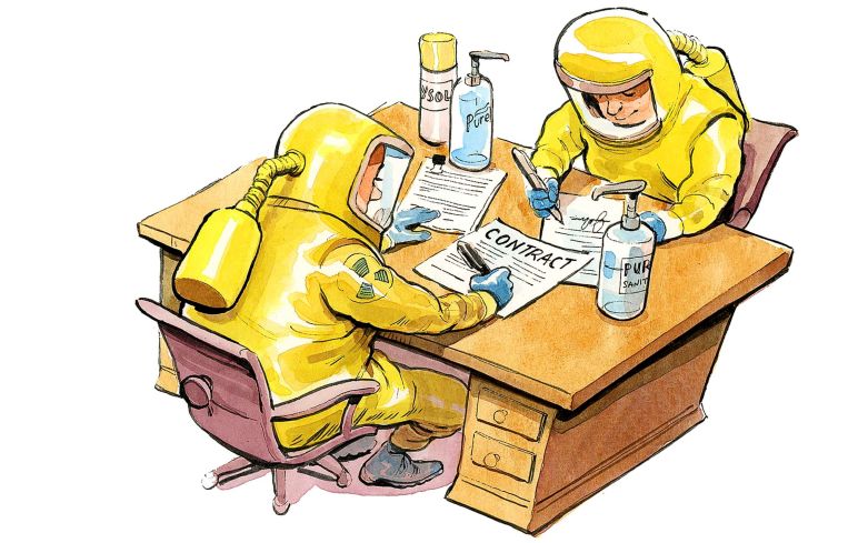 Two men at desk in hazmat suits