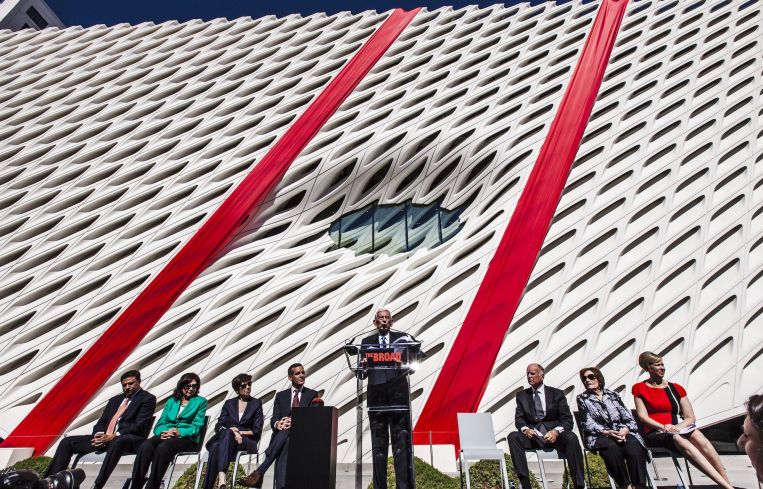 A civic dedication and ribbon-cutting ceremony in 2015 for The Broad museum in Downtown Los Angeles. Eli Broad center, is flanked by former California Gov. Jerry Brown to the right, and Mayor Eric Garcetti to the left. The $140 million museum houses the Broads' art collections. The building was designed by Diller Scofidio + Renfro.