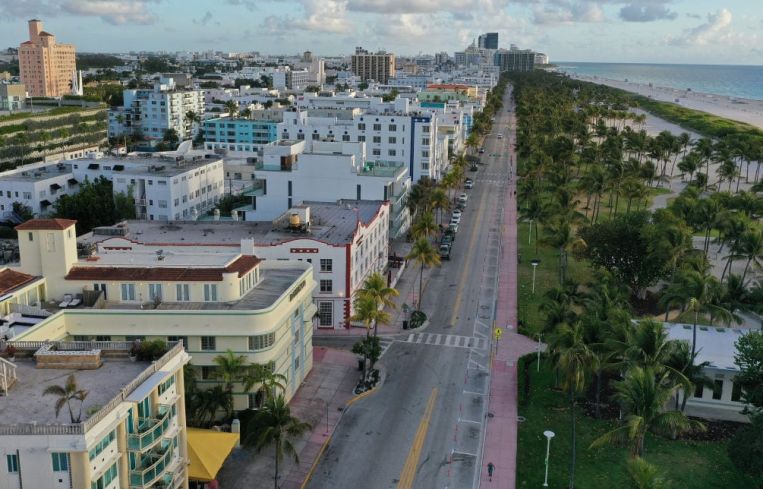 In this aerial view from a drone, desolate Ocean Drive is seen after most visitors have checked out of their hotels on March 24, 2020 in Miami Beach, Florida.