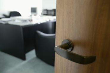 A doorknob opening into an office.