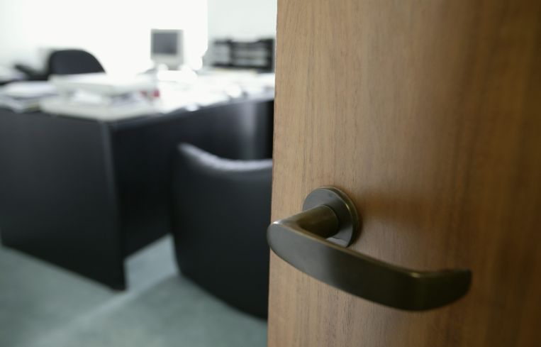 A doorknob opening into an office.