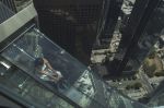 A woman slides down the Skyslide, 70 floors up on the outside of the U.S. Bank Tower in June, 2016