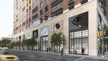 A rendering of Google's planned store in Chelsea. It's a tan building with big windows and images of Google products above them.