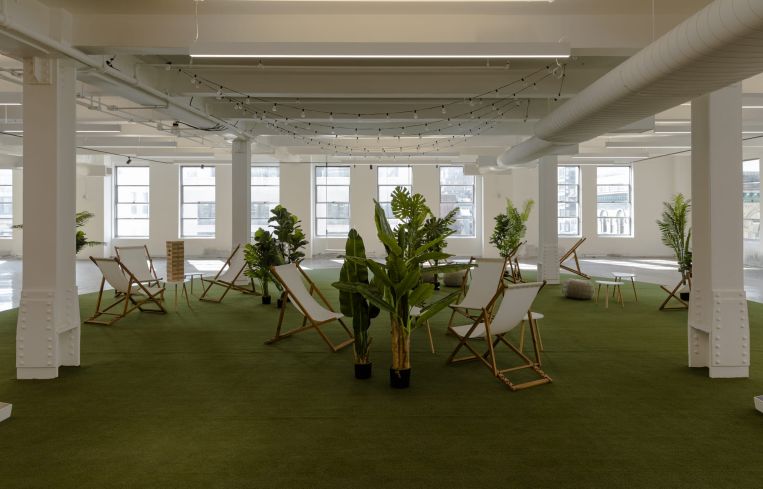 The marketing floor of 295 Fifth includes lawn games, chairs and a swing set.