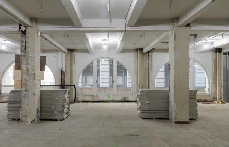 One of the lower floors of the building has unusual semicircle windows.