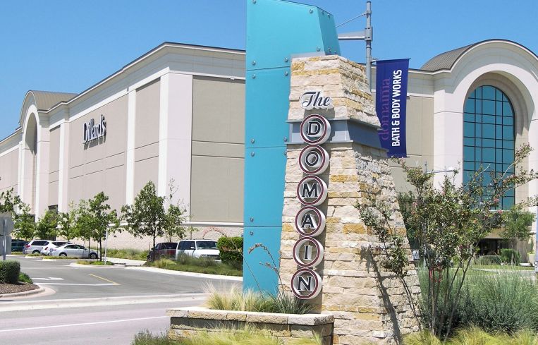 An image of one section of Simon Property Group's The Domain, with Dillard's in the background.