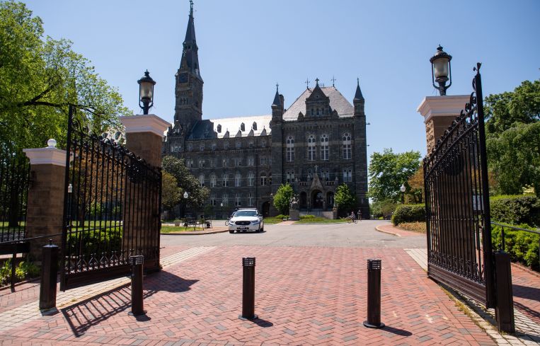 A large, open gate in front of a building.