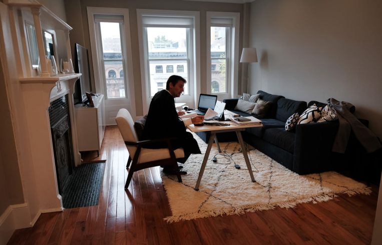 New York City Criminal Court Judge Paul McDonnell works remotely from his Brooklyn apartment due to the coronavirus outbreak. Judge McDonnell, who usually presides over cases in a Manhattan court room, has had to alter his work routine by hearing cases remotely due to the virus outbreak.