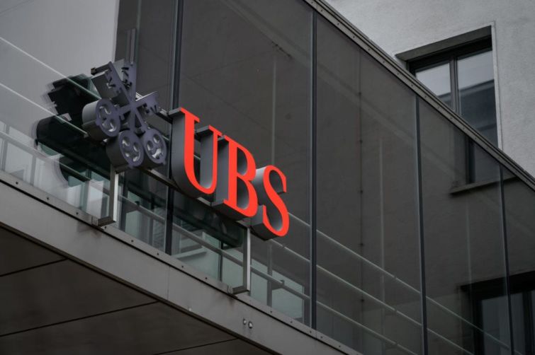 This photograph taken on March 3, 2021 in Zurich shows a sign of Swiss banking giant UBS on their headquarters.