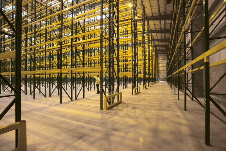 Empty warehouse with shelving and racks. The project, called Knox Logistics VII, is situated on 73 acres at 19115 Harvill Avenue in the city of Perris in Riverside County.