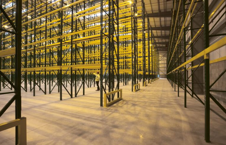 Empty warehouse with shelving and racks. The project, called Knox Logistics VII, is situated on 73 acres at 19115 Harvill Avenue in the city of Perris in Riverside County.