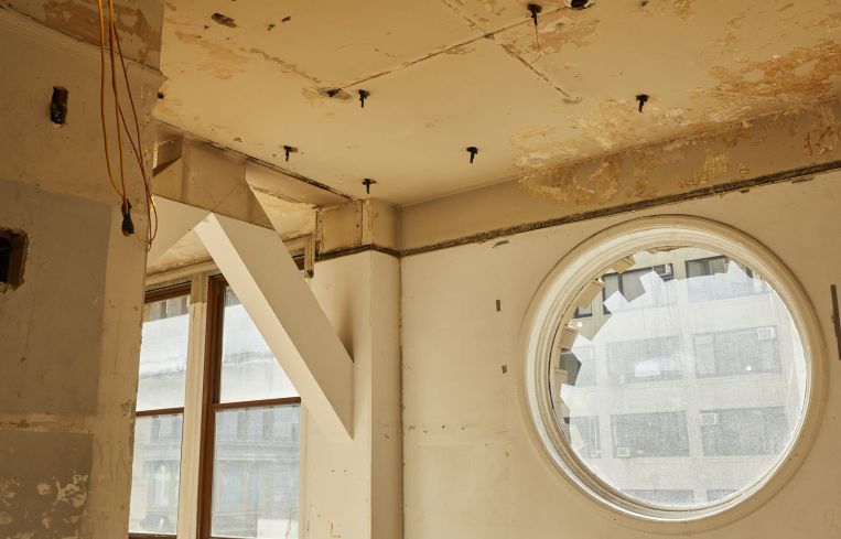 The second floor includes round nautical windows.