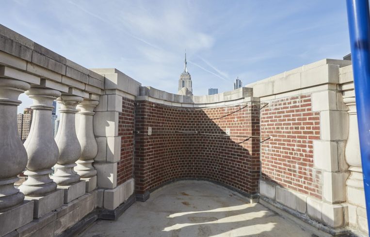 The top floor outdoor space is being converted into a private roof deck.