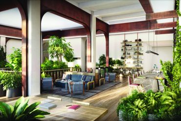 A former textile showroom building at 295 Fifth Avenue is getting a $350 million renovation that includes a new lobby lounge and coffee bar with plenty of greenery and soft seating. 