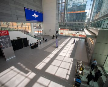 A capacious convention center with large windows.