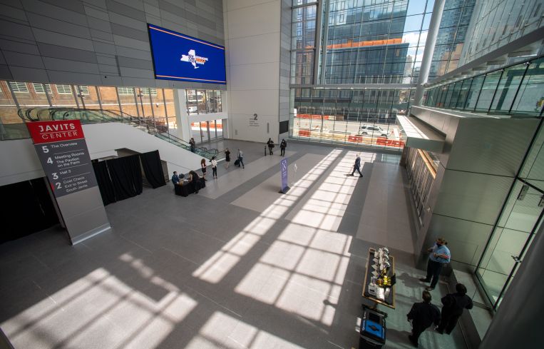 A capacious convention center with large windows.
