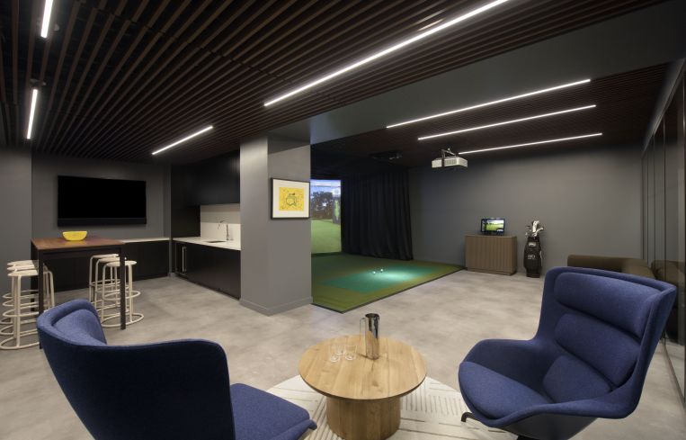 The new basement golf simulator and lounge.