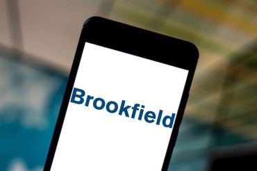 In this photo illustration the Brookfield Asset Management logo is seen displayed on a smartphone.