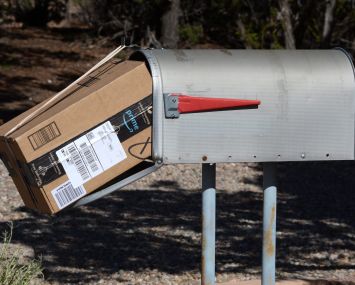 An Amazon Prime package delivered to a mailbox.