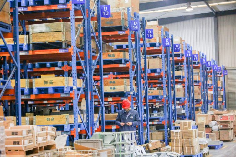Employees work at a warehouse. Demand for quality industrial space has never been higher.