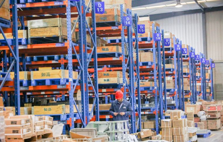 Employees work at a warehouse. Demand for quality industrial space has never been higher.