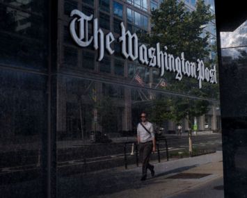 A man walks past The Washington Post on August 5, 2013 in Washington, DC.