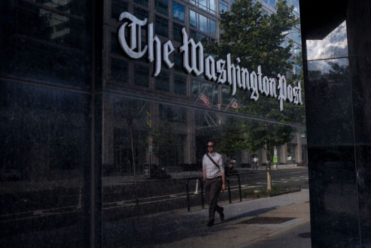 A man walks past The Washington Post on August 5, 2013 in Washington, DC.