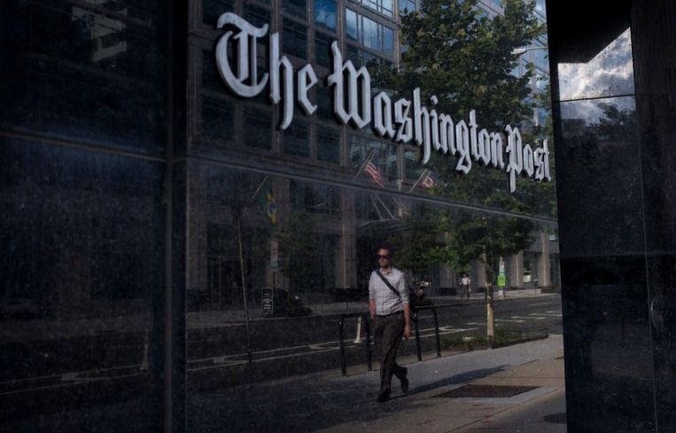 A man walks past The Washington Post on August 5, 2013 in Washington, DC.