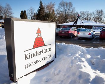 Signage in front of a KinderCare facility in Palantine, Ill.