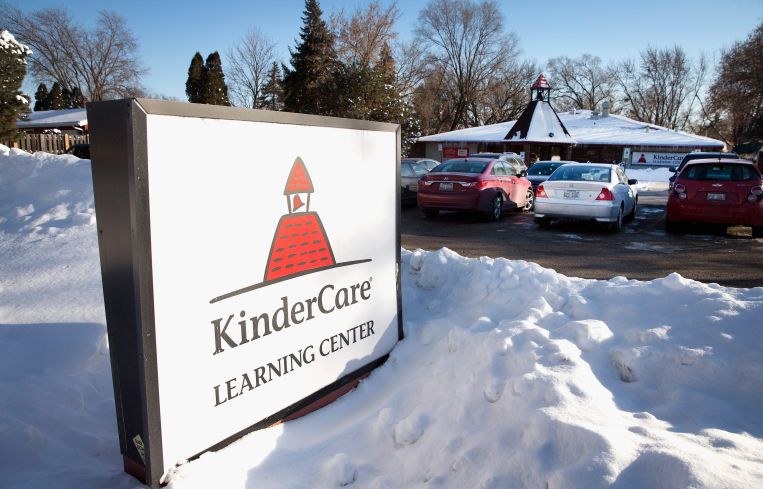 Signage in front of a KinderCare facility in Palantine, Ill.