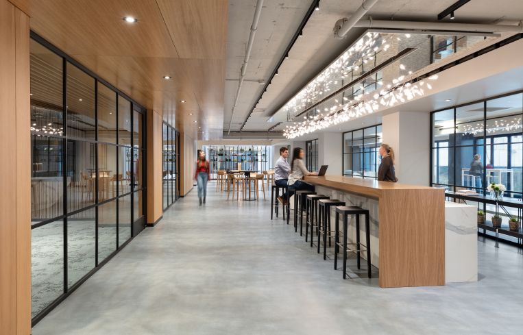 The second-floor amenity center includes a coffee bar, conference center and various seating areas.