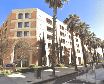 The five-story apartment community at 225 West 3rd Street is located near the I-710 Freeway, Long Beach Airport, and Cal State University Long Beach.