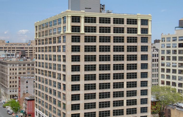 The exterior of the 15-story office building at 250 Hudson.