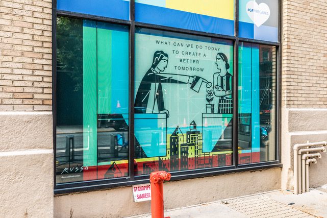 A mural in the window of a shop.