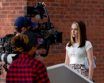 Zoey Deutch on set.