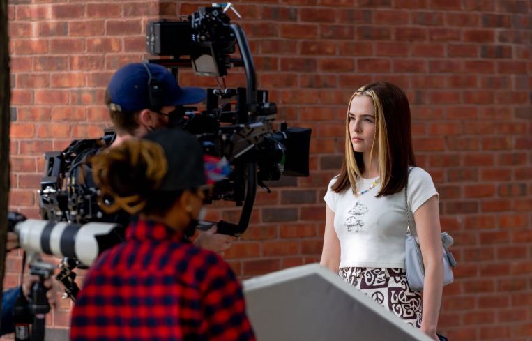 Zoey Deutch on set.