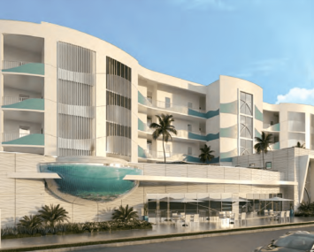 A large white building with a rounded terrace in Miami Florida, with palm trees around it.