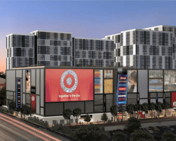 A large apartment complex with a target in front with a large red target sign.