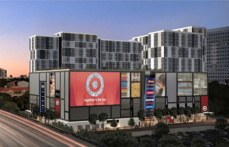 A large apartment complex with a target in front with a large red target sign.