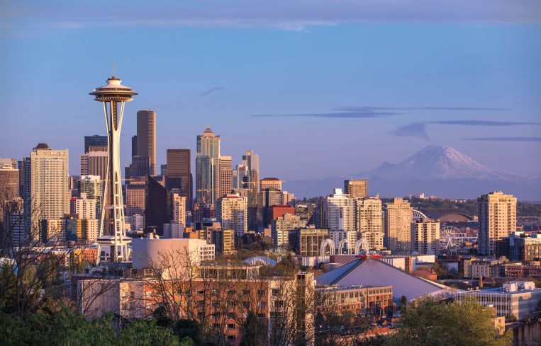 Seattle's iconic skyline with Mount Rainier in the distance.